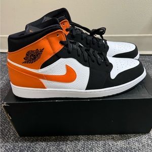 Jordan 1 mid black and orange